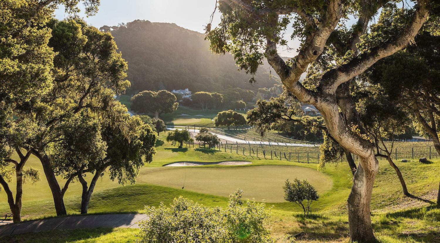 Green golf course, oak trees and rolling hills at Carmel Valley Ranch